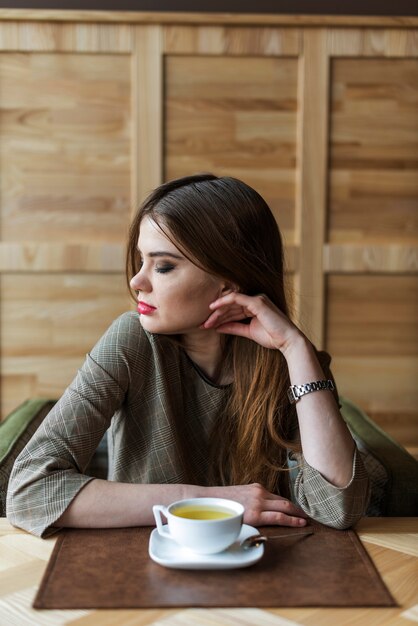 Young woman thinking and looking down