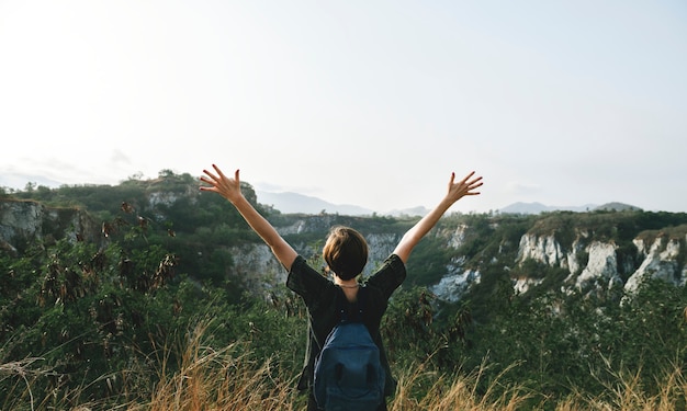 Free photo young woman travel nature concept