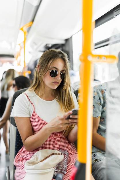 Free photo young woman traveling by bus