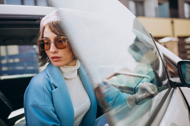 Young woman travelling by electric car