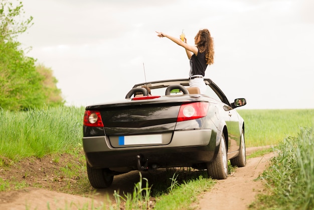 Young woman on a trip in a car