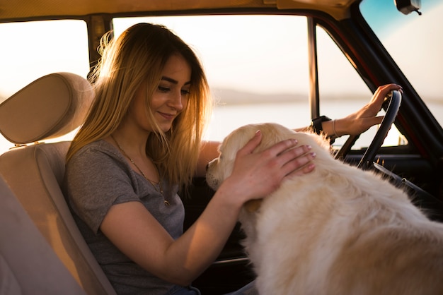 Free Photo young woman on a trip in a car