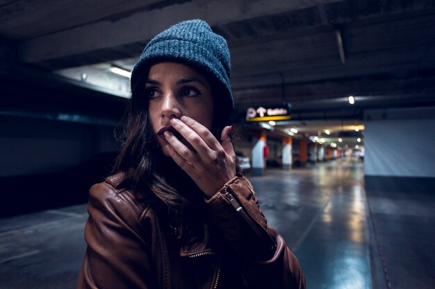 Young woman in underground parking