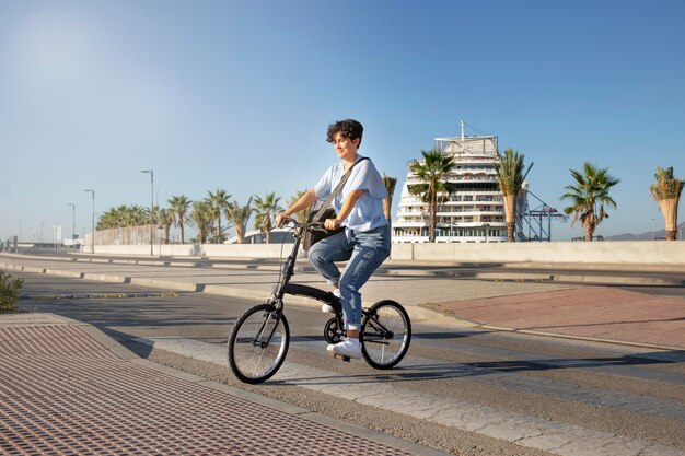 Young woman using her folding bike