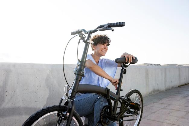 Young woman using her folding bike