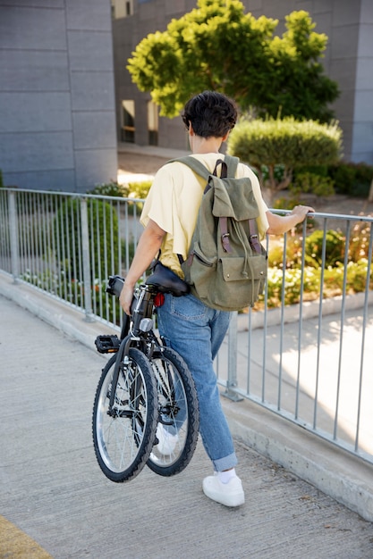 Young woman using her folding bike