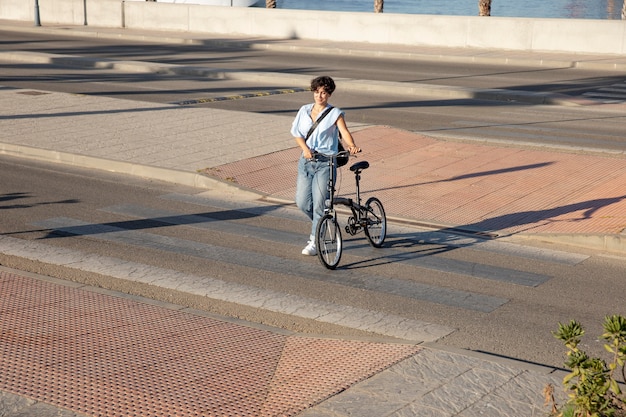 Young woman using her folding bike