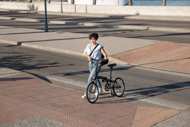 Young woman using her folding bike