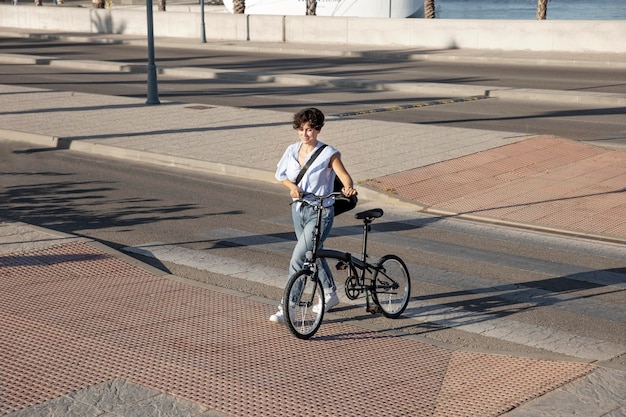 Young woman using her folding bike