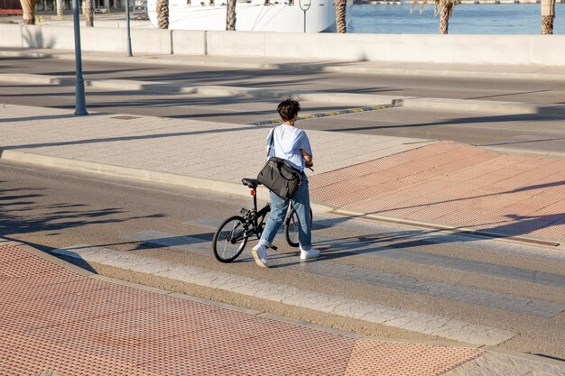 Young woman using her folding bike