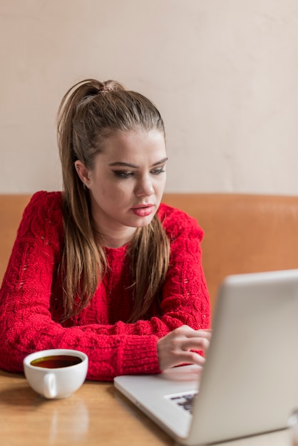 Young woman using her laptop