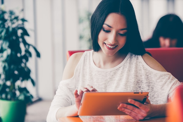 Young woman using her tablet