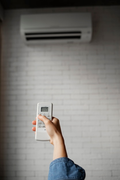 Free photo young woman using home technology