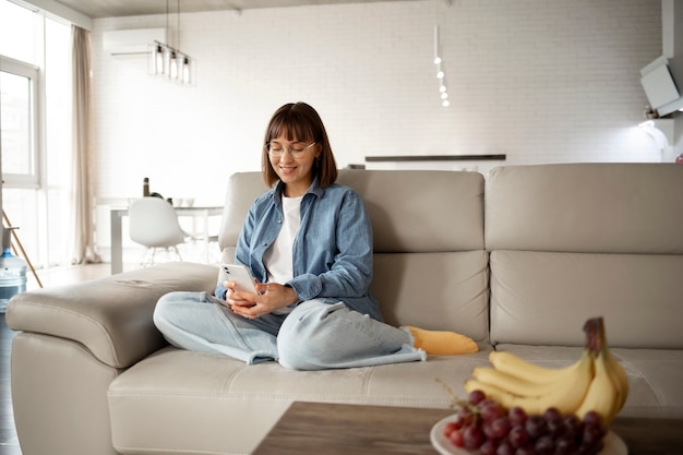 Young woman using home technology