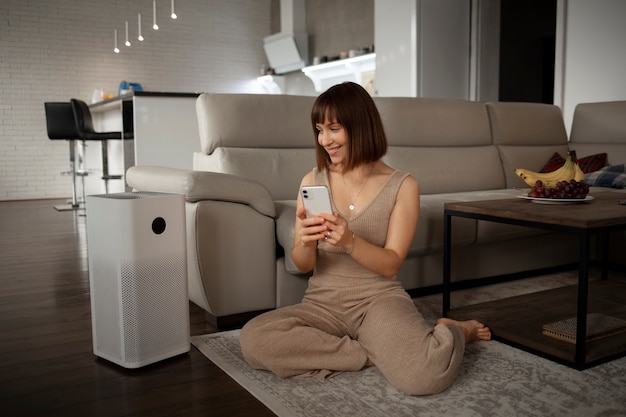 Young woman using home technology