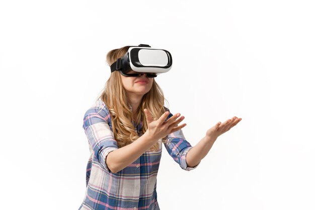 Free Photo young woman using vr-headset devices, gadgets isolated on white studio wall