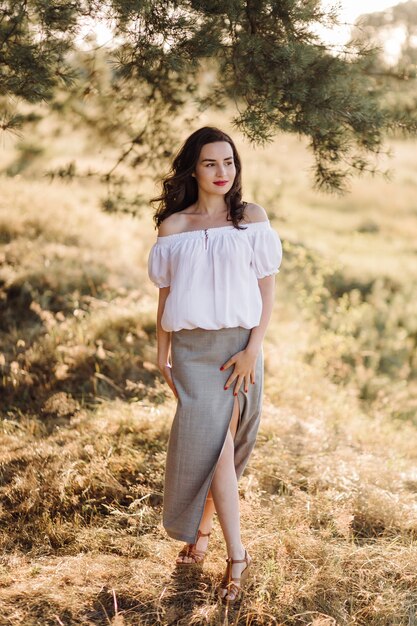 Young woman walking in forest