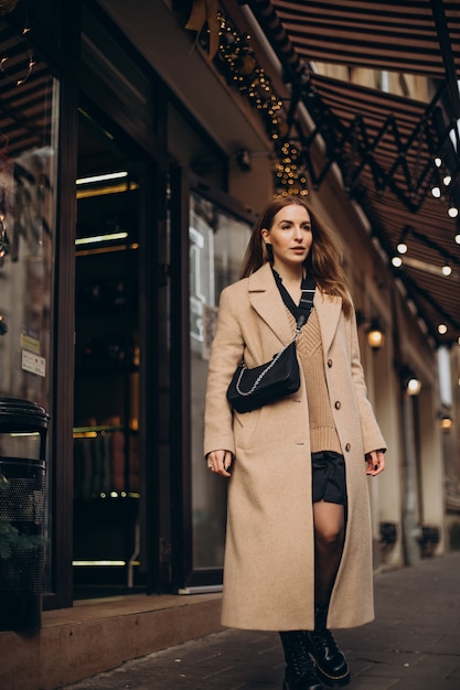 Young woman walking in the street