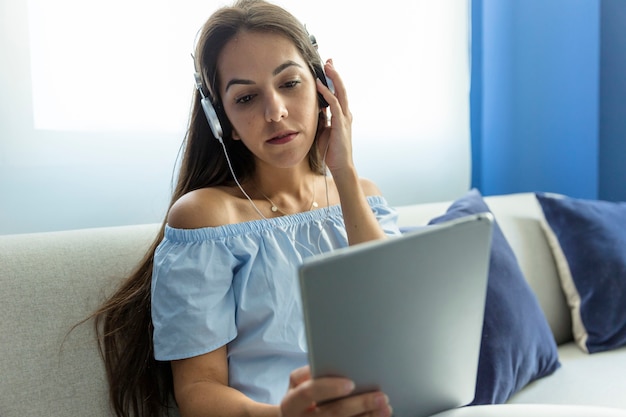 Young woman watching video on tablet