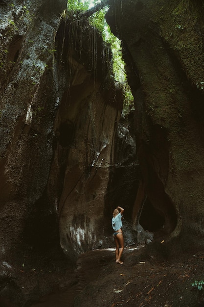 young woman at the waterfall in the rock Bali Indonesia