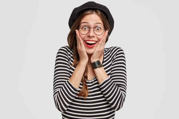 Young woman wearing beret and striped shirt