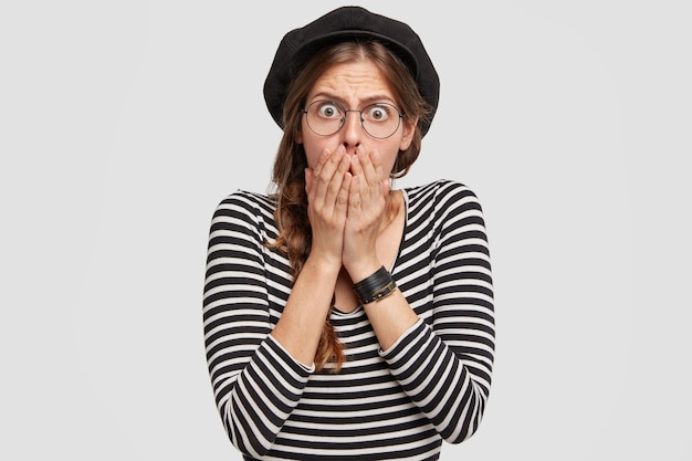 Young woman wearing beret and striped shirt