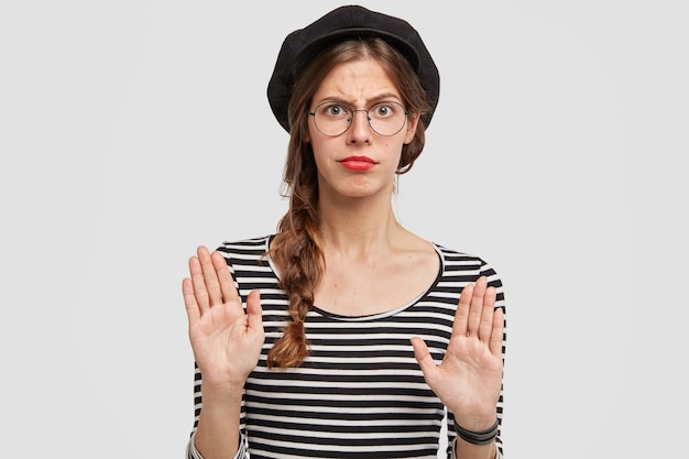 Free Photo young woman wearing beret and striped shirt