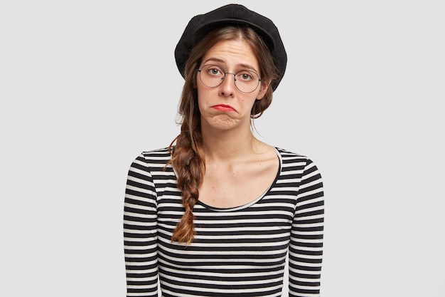 Young woman wearing beret and striped shirt