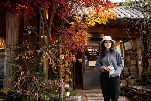 Young woman wearing a bucket hat in the city