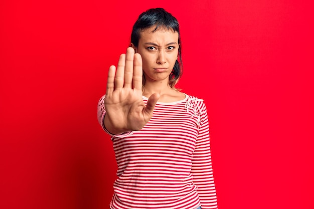 Free photo young woman wearing casual clothes doing stop sing with palm of the hand warning expression with negative and serious gesture on the face