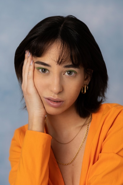 Free photo young woman wearing chain necklace