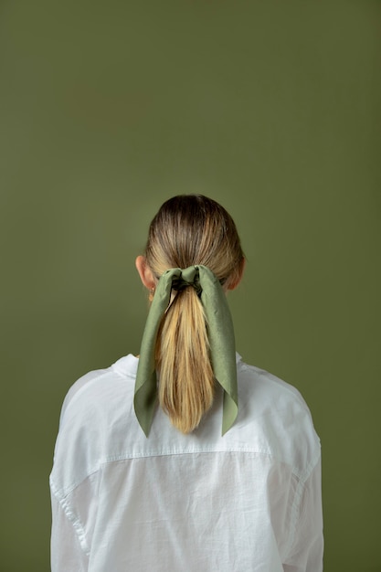 Free photo young woman wearing a handkerchief as a hair accessory