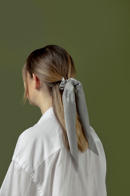 Free photo young woman wearing a handkerchief as a hair accessory