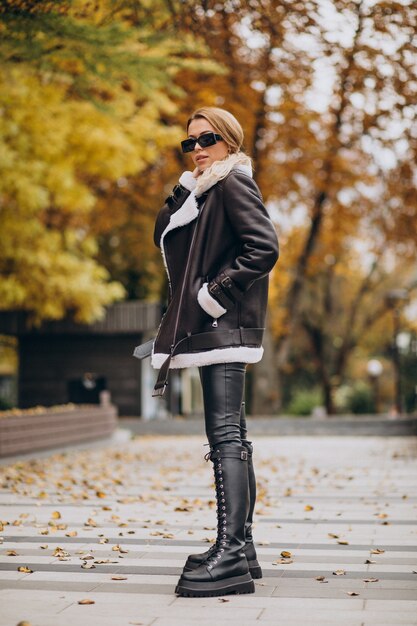 Young woman wearing jacket walking outside