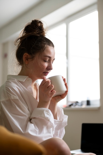 Young woman wearing messy bun hairstyle