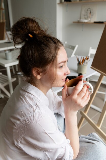 Young woman wearing messy bun hairstyle