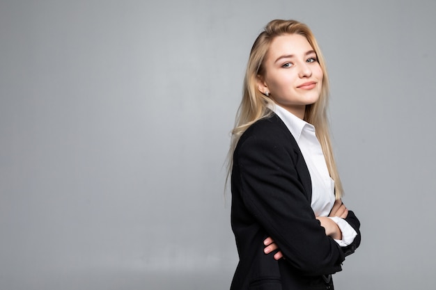 Free Photo young woman wearing standing with folded arms looking with a serious expression isolated