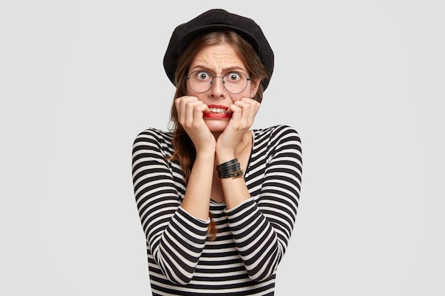 Young woman wearing striped shirt and beret