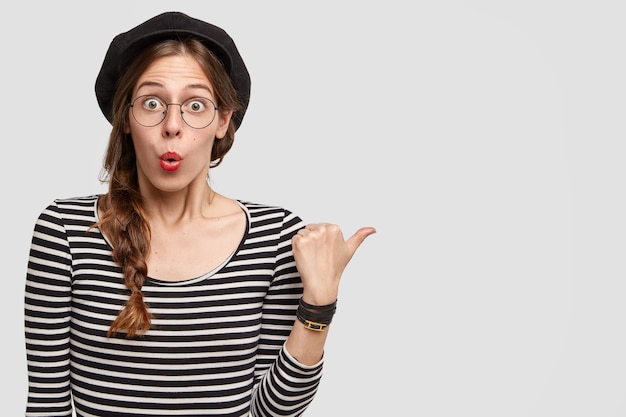 Young woman wearing striped shirt and beret