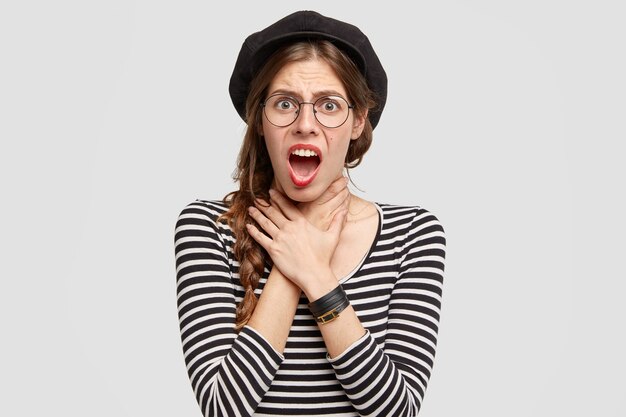 Young woman wearing striped shirt and beret