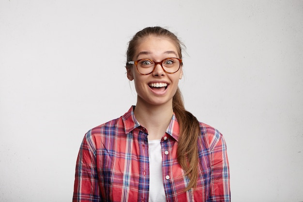 Young woman wearing striped shirt and eyeglasses