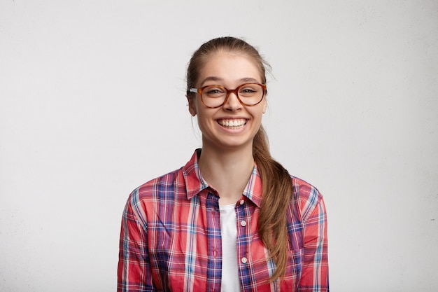 Young woman wearing striped shirt and eyeglasses