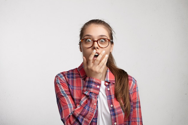 Free Photo young woman wearing striped shirt and eyeglasses