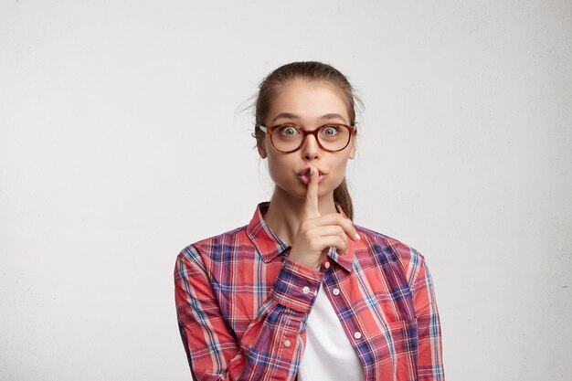 Young woman wearing striped shirt and eyeglasses