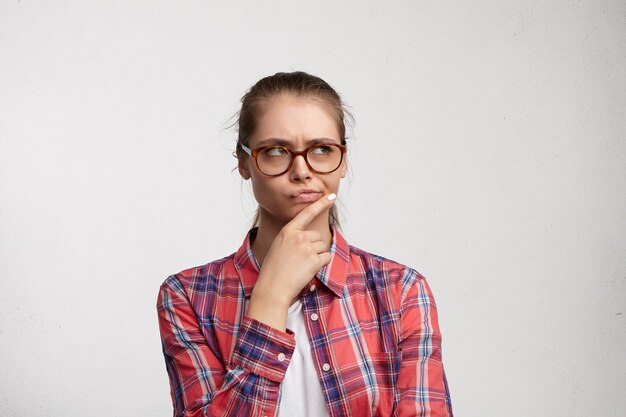 Young woman wearing striped shirt and eyeglasses