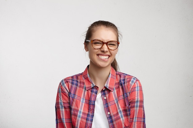 Young woman wearing striped shirt and eyeglasses