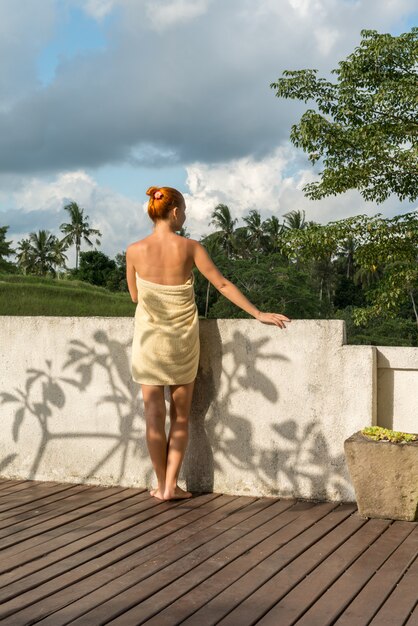 Young woman wearing towel