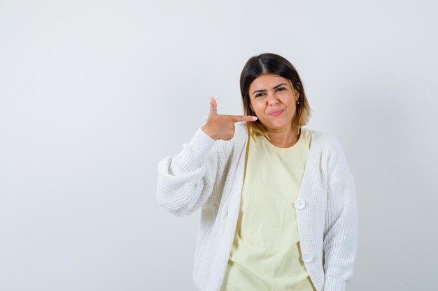 Young woman wearing a white cardigan