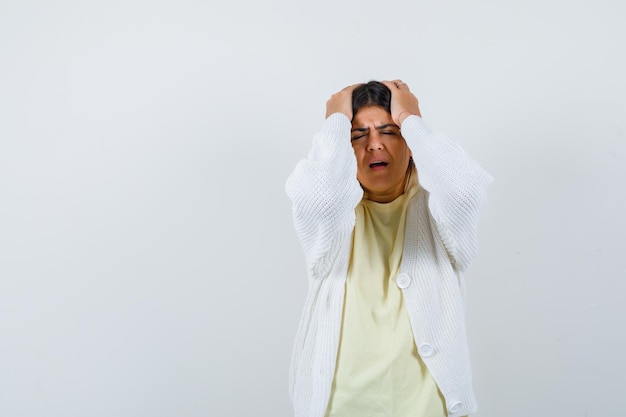 Young woman wearing a white cardigan