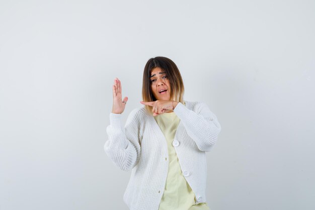 Young woman wearing a white cardigan